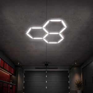 Three illuminated interconnected white hexagon LED lights in a compact triangular cluster