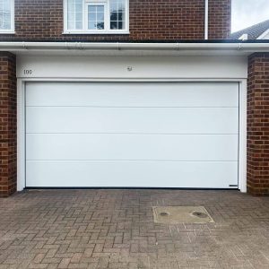 Illustrative image – White sectional garage door installation illustrative example